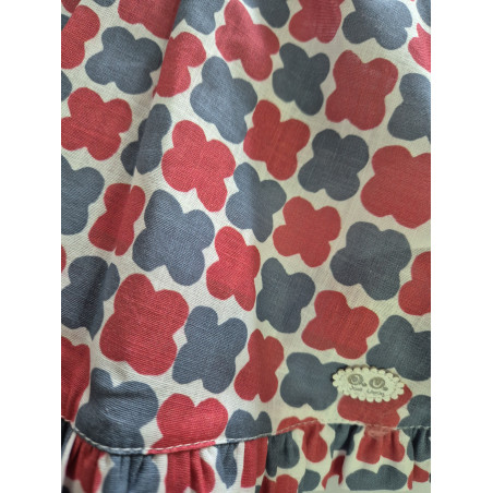Jesusín estampado azul y rojo espalda escotada.